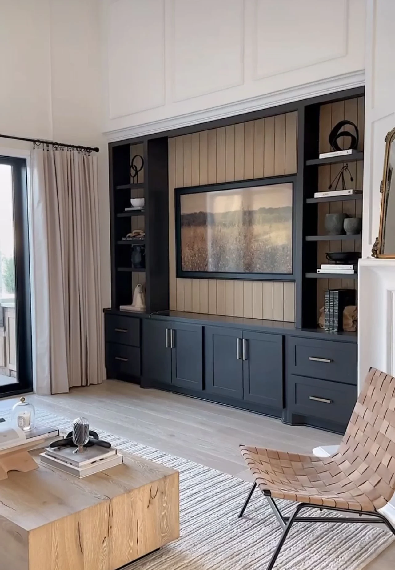 Built-in storage wall unit in a Dubai apartment with modern joinery and space-saving cabinetry.