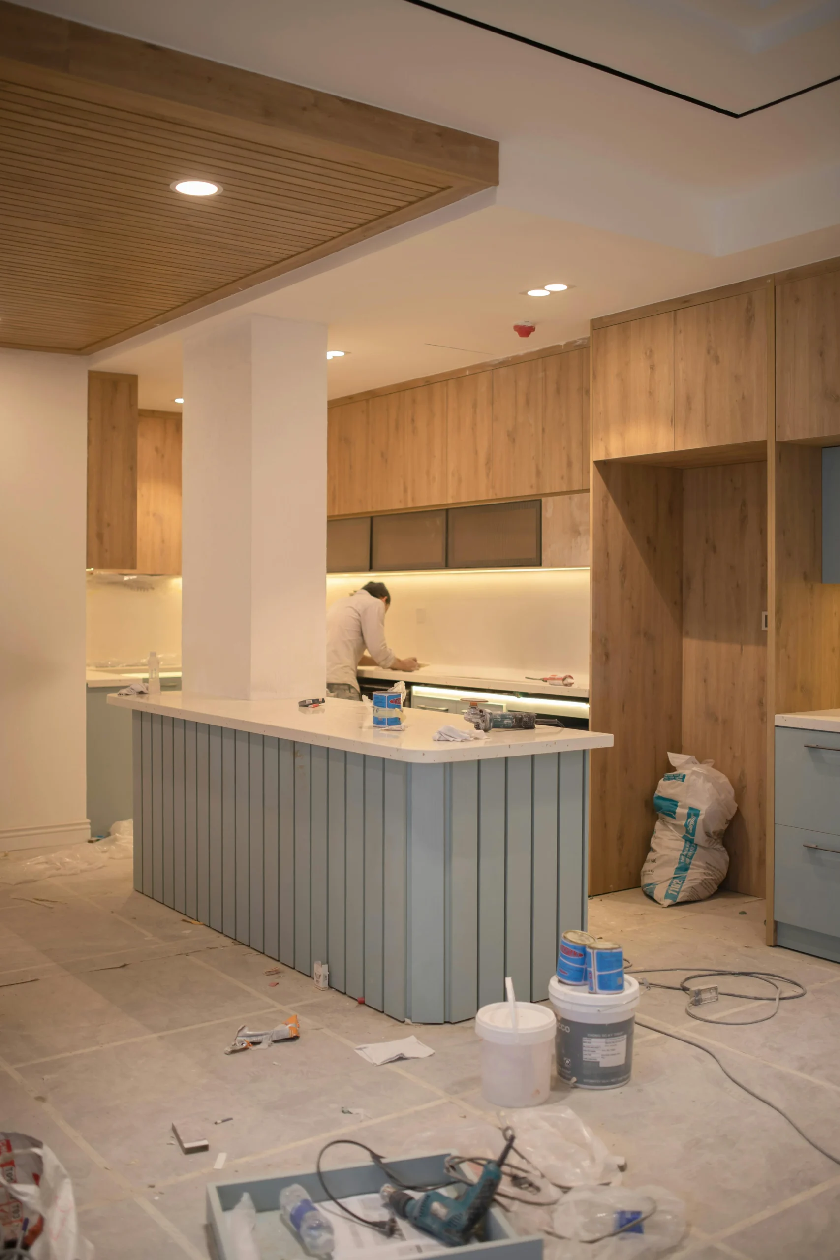 Full kitchen renovation in Dubai showing cabinet installation during a complete kitchen remodeling project.