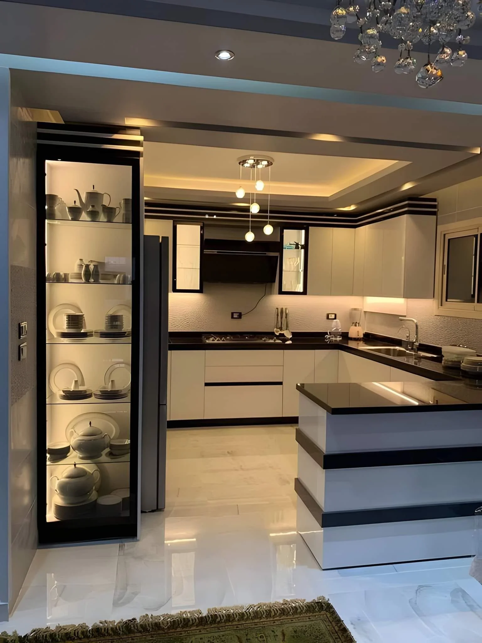 Modern kitchen renovation in Dubai with built-in cabinets and matching custom wardrobes for extra storage