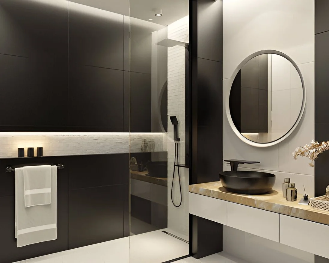 Modern bathroom wall and floor tiling in Dubai with large-format tiles, glass shower screen, and clean grout lines