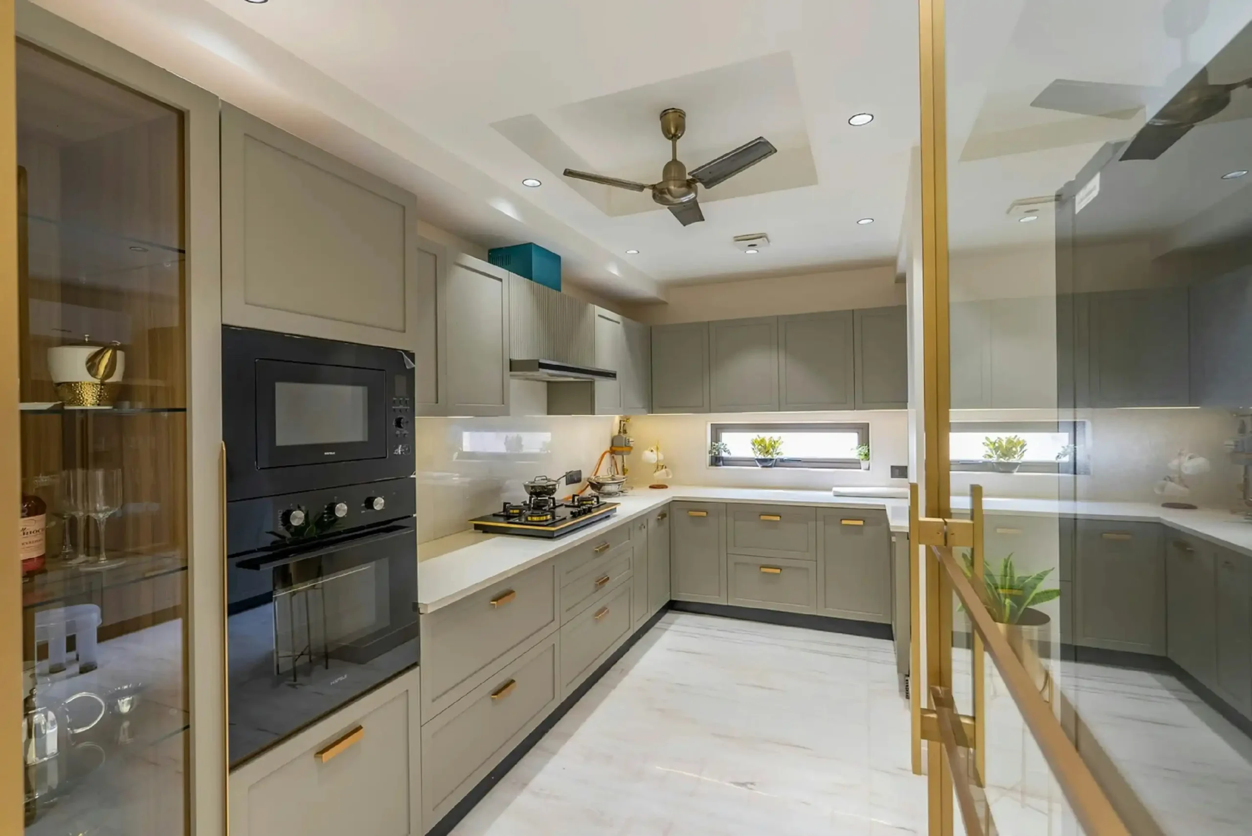 U-shape kitchen renovation in Dubai with sleek cabinetry and integrated appliances.