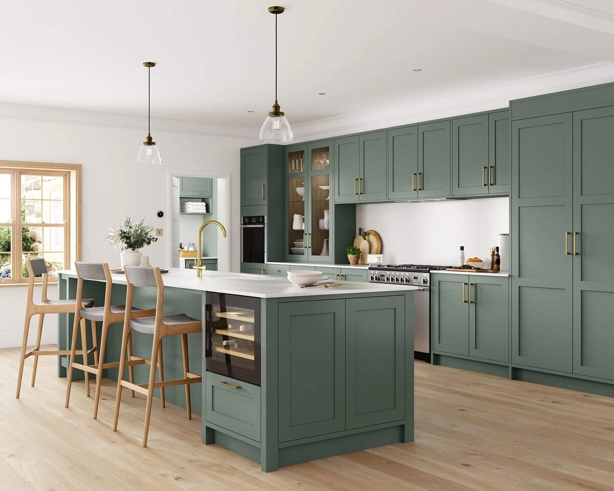 Custom kitchen cabinets with green shaker doors, tall units, and island seating