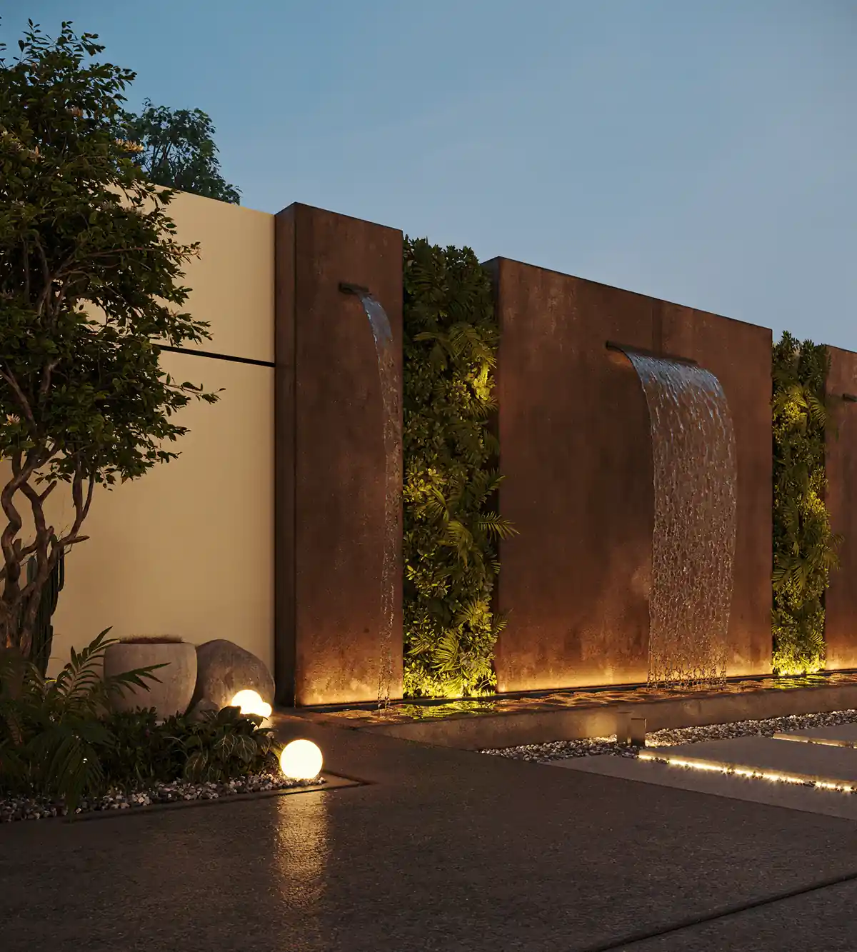 Lit wall water feature with waterfall panels and greenery in a modern Dubai villa courtyard.